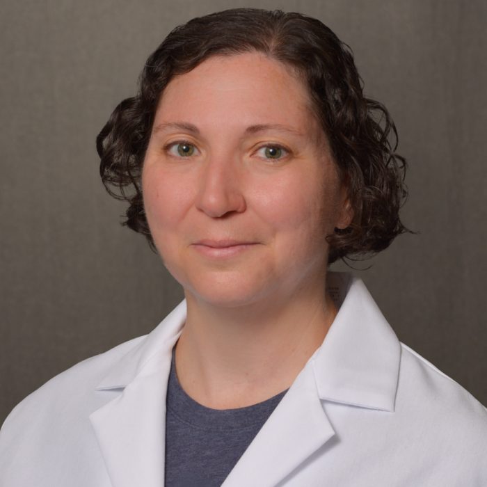 female nurse practitioner with short brown hair