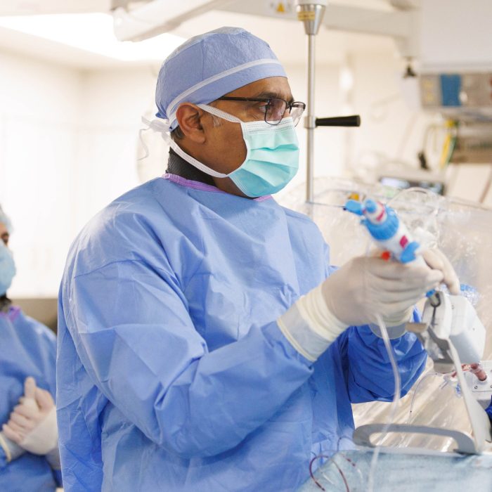 physician doing Transcatheter Mitral Valve Replacement
