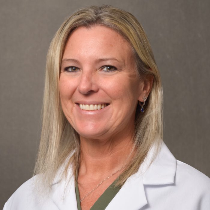 blonde haired nurse practitioner in lab coat