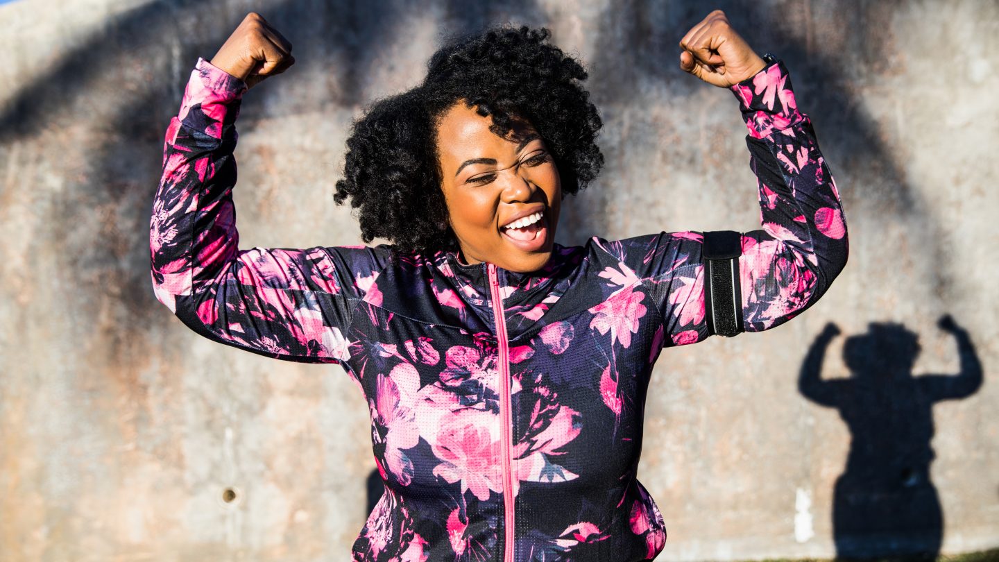 Funny portrait of a young black curvy woman during a training session