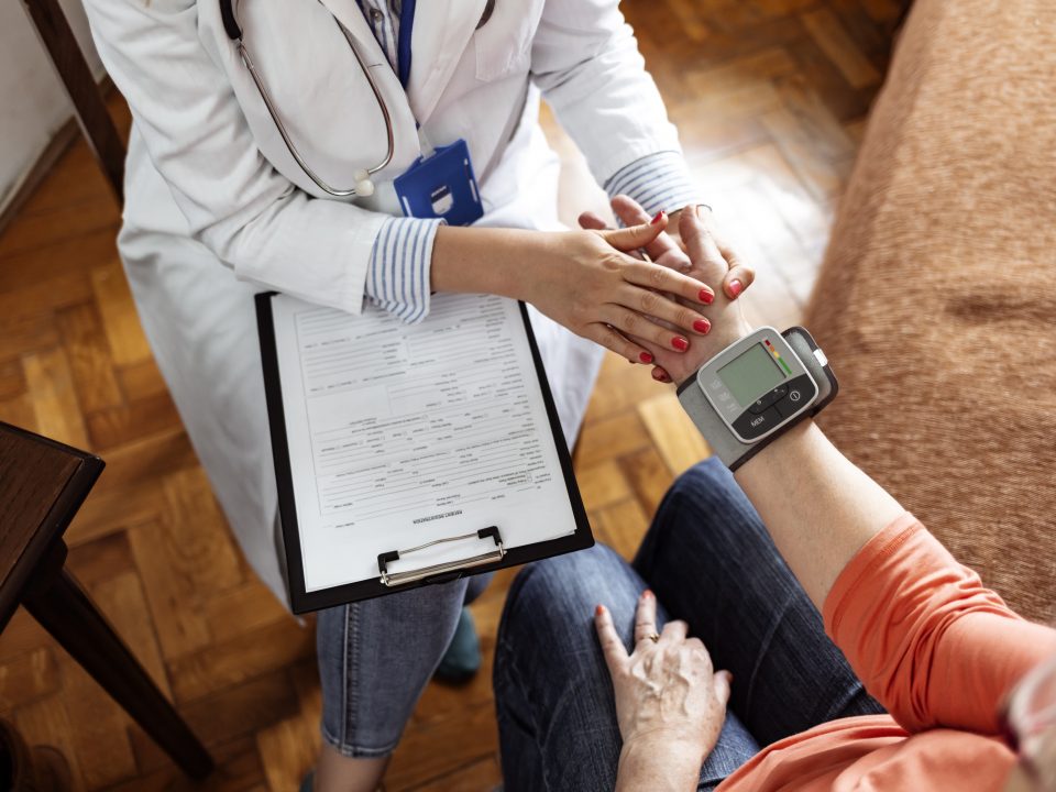 Senior woman taking blood pressure