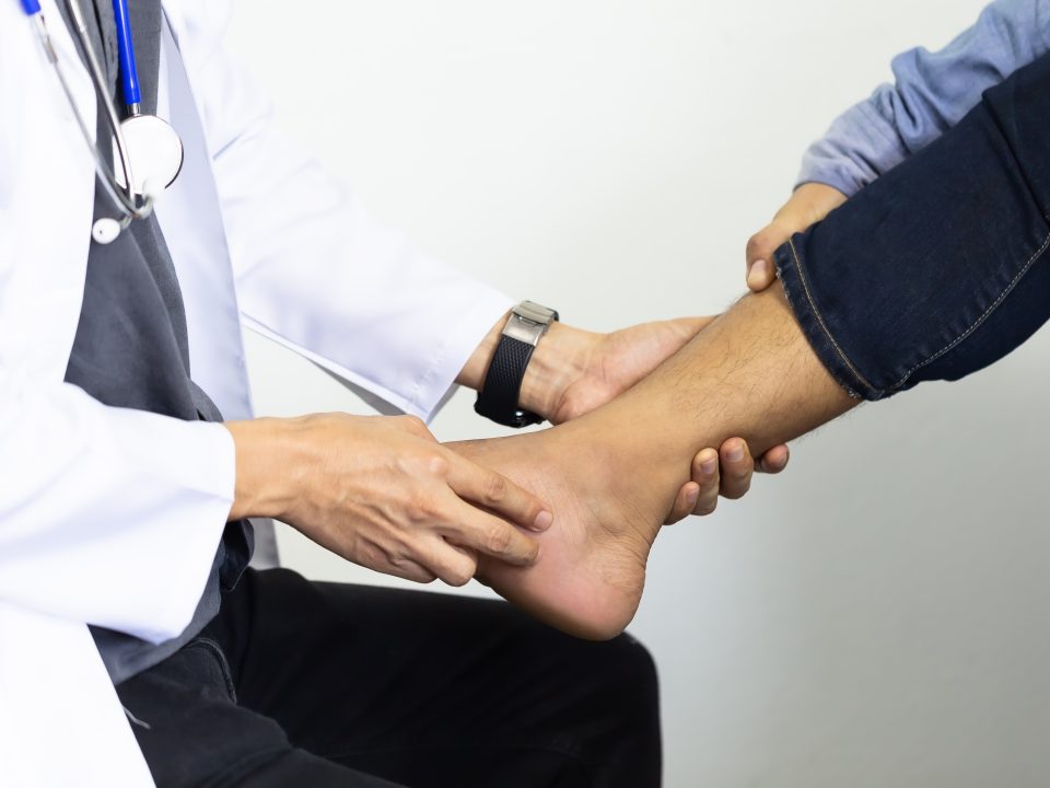 doctor checking ankle